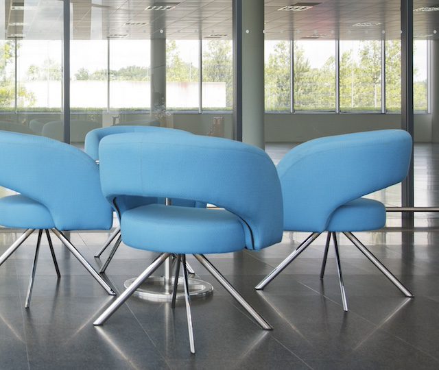 Chairs and table in office lobby area